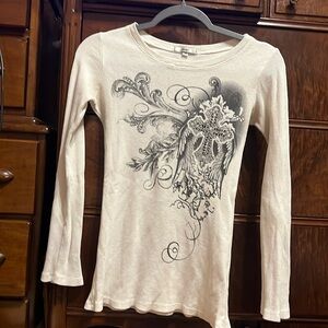 White thermal with black art detail.